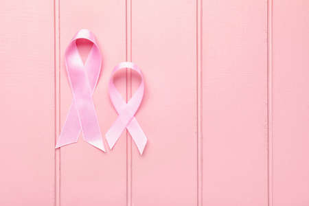 Pink ribbons on white wooden background. Breast cancer awareness conceptの写真素材