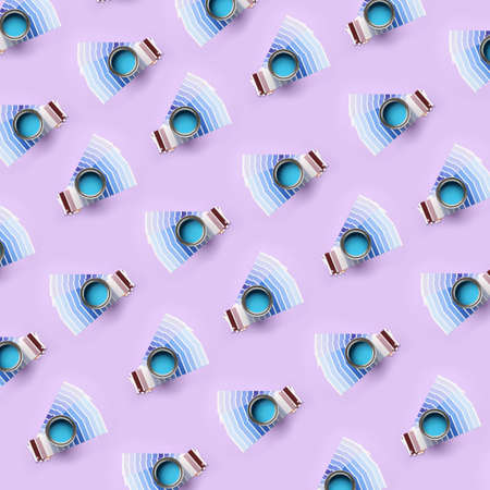 Many cans of blue paint with palette samples on color backgroundの写真素材