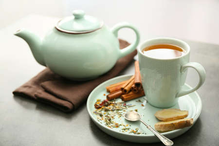 Composition with hot tea on tableの写真素材