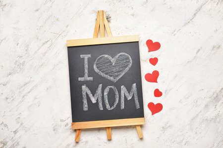 Chalkboard with text I LOVE MOM on white backgroundの写真素材