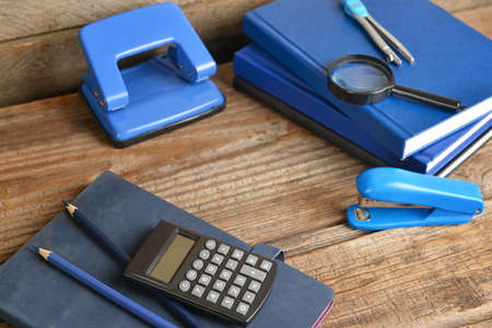 Set of school supplies on wooden table