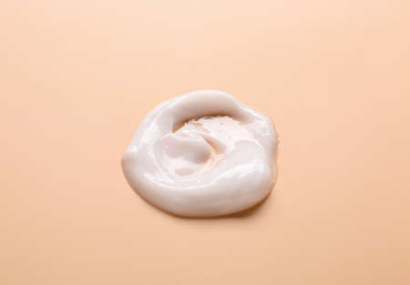 Sample of cream on color background