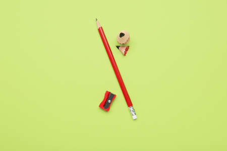 Ordinary pencil and sharpener on color backgroundの写真素材