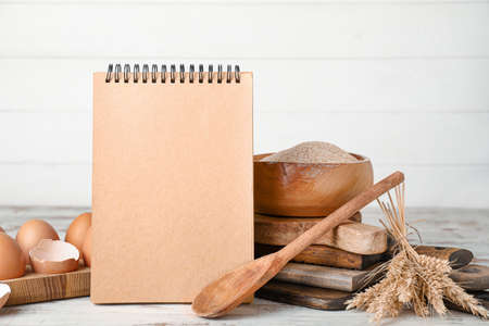 Cook book with products on tableの写真素材