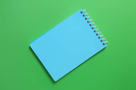 School notebook on color background