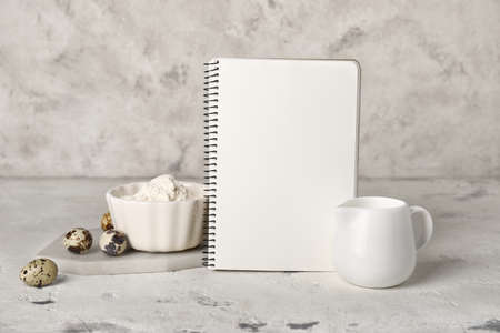 Cook book with products on light backgroundの写真素材