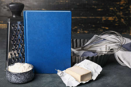 Cook book with products on dark backgroundの写真素材