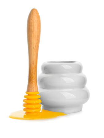 Jar with sweet honey on white backgroundの写真素材