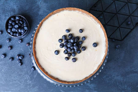 Sweet tasty cheesecake on table