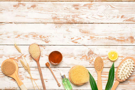 Bath items and honey on white wooden backgroundの写真素材