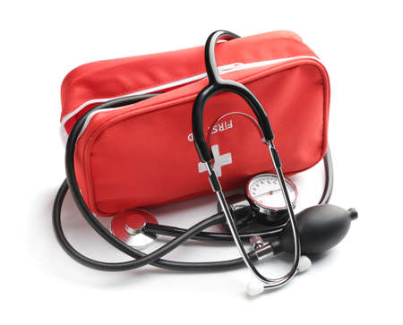 Bag with sphygmomanometer and stethoscope on white background