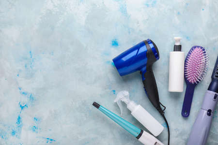 Modern hairdresser tools on color backgroundの写真素材