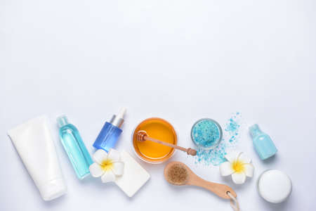 Composition with spa items and honey on white backgroundの写真素材