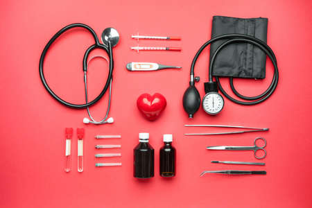 First aid kit on color background