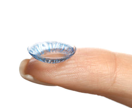 Finger with contact lens on white backgroundの写真素材