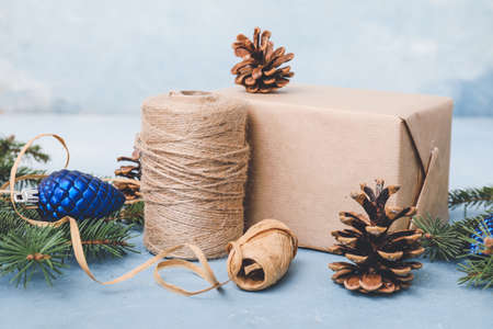 Beautiful gift for Christmas with decor on color backgroundの写真素材