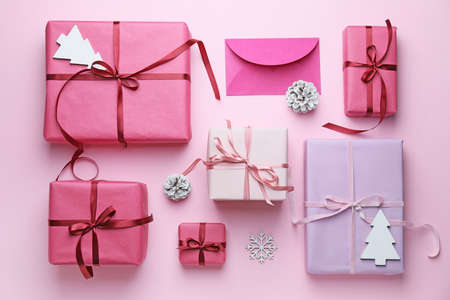Beautiful gifts for Christmas on color backgroundの写真素材
