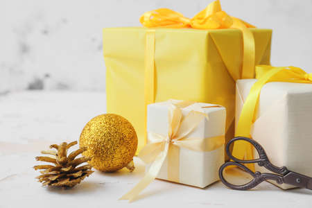Beautiful gifts for Christmas with decor on white backgroundの写真素材