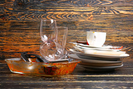 Dirty tableware on wooden backgroundの写真素材