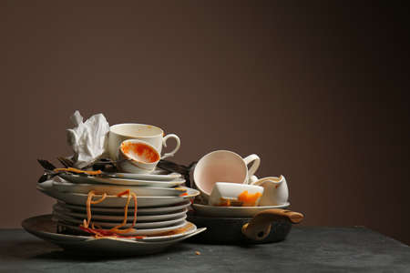 Dirty tableware on dark backgroundの写真素材