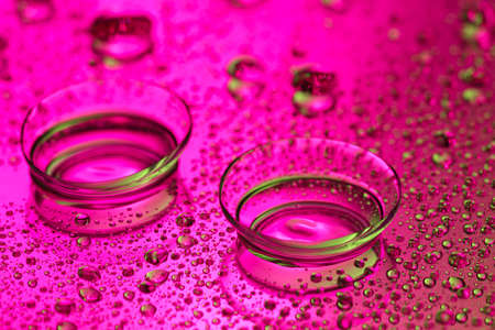 Contact lenses on color backgroundの写真素材