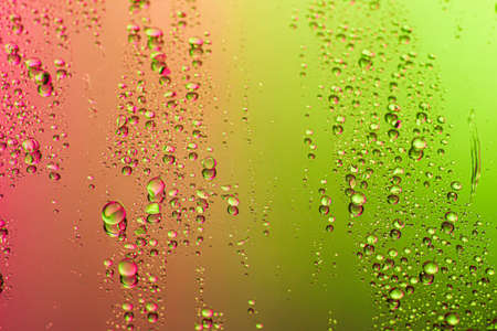 Drops of water on color background