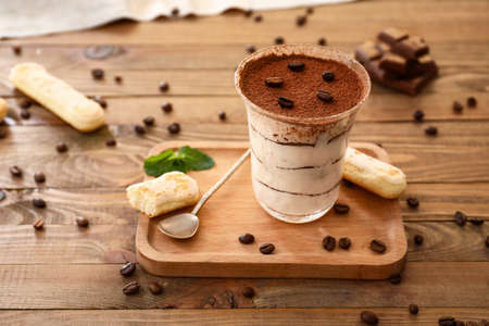 Tasty tiramisu on wooden tableの写真素材