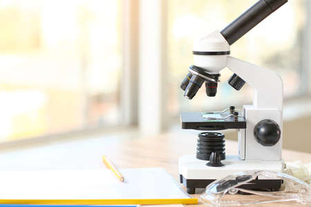 Microscope on table in classroomの写真素材