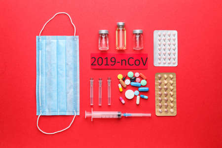 Protective mask and medicines for Coronavirus on color backgroundの写真素材