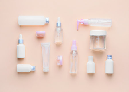 Different cosmetic products on color background