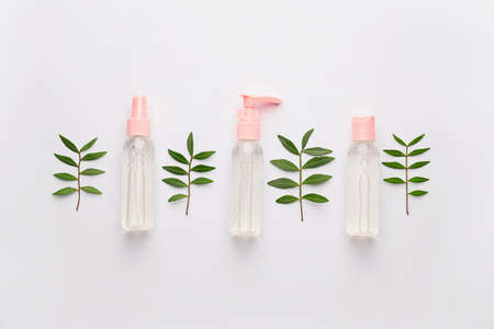 Different cosmetic products in bottles on white backgroundの写真素材