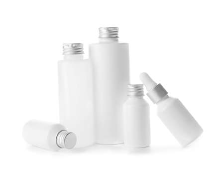 Different cosmetic products in bottles on white backgroundの写真素材