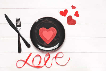 Beautiful table setting for Valentine's Day on white wooden backgroundの写真素材