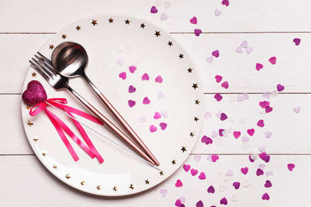 Beautiful table setting for Valentine's Day on white wooden backgroundの写真素材