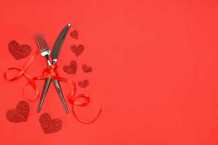 Beautiful table setting for Valentine's Day on red backgroundの写真素材