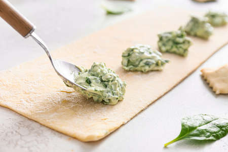 Preparing of tasty ravioli on tableの写真素材