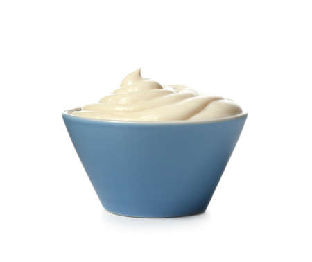 Bowl with tasty cream cheese on white backgroundの写真素材
