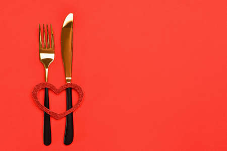 Beautiful table setting for Valentine's Day on red backgroundの写真素材