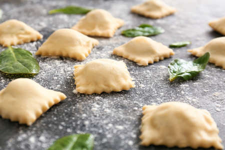 Uncooked ravioli on dark backgroundの写真素材