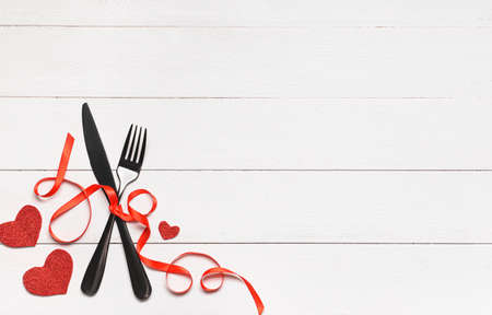 Beautiful table setting for Valentine's Day on white wooden backgroundの写真素材