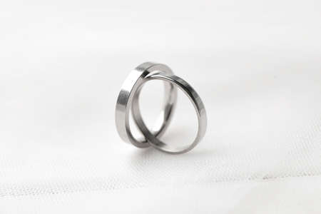 Beautiful wedding rings on white background