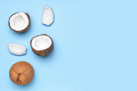 Ripe coconuts on color backgroundの写真素材