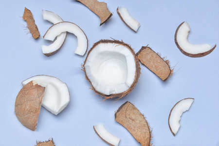 Ripe coconuts on color backgroundの写真素材