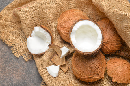 Ripe coconuts on gray background