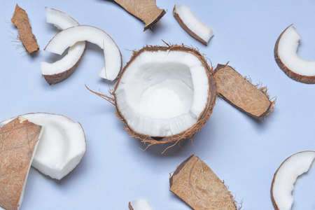 Ripe coconuts on color background