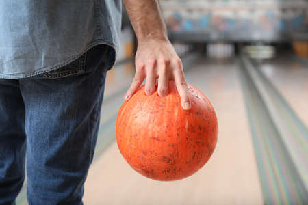 Man playing bowling in clubの写真素材