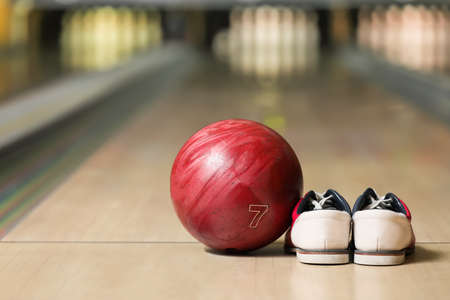 Ball and shoes on floor in bowling clubの写真素材