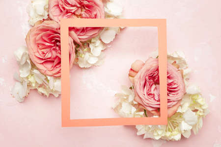 Beautiful flowers and frame on color backgroundの写真素材