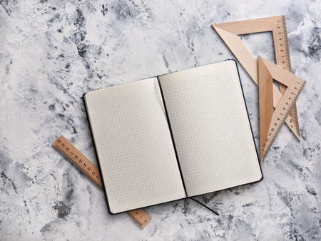 Notebook with rulers on white backgroundの写真素材