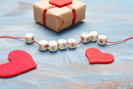 Gift for Mother's Day on color wooden backgroundの写真素材